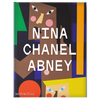 Book titled 'Nina Chanel Abney' with colorful design on a white background