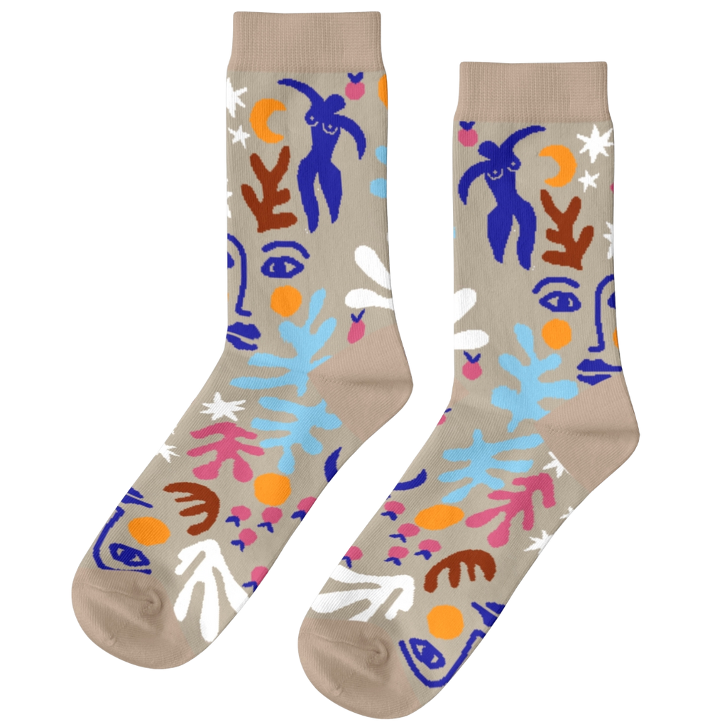 Colorful abstract-patterned socks on a beige background