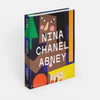 Book titled 'Nina Chanel Abney' with colorful design on a white background